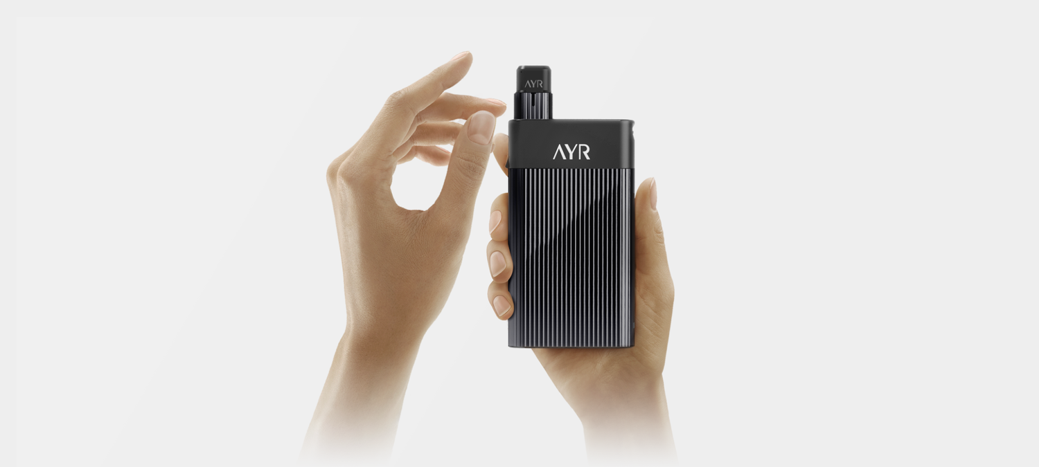 The Ayr vaporizer being held in a hand